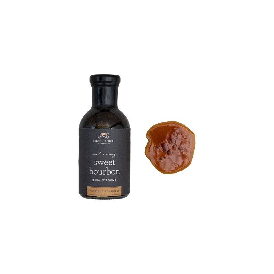 Bottle of sweet bourbon grilling sauce with a sample on a white background.  Available at Be Charmed.