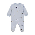 Light blue baby onesie with car pattern on a white background. Available at Be Charmed.