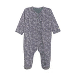 Floral patterned baby onesie on a white background. Available at Be Charmed.