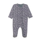 Floral patterned baby onesie on a white background. Available at Be Charmed.