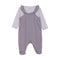 Purple baby romper with heart accents on a white background. Available at Be Charmed.