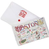 Folded Be Charmed Boston dish towel featuring Catstudio’s iconic skyline illustration—absorbent cotton tea towel perfect for kitchen décor and gifts, available at Be Charmed.