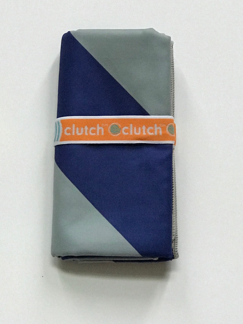 Folded 32″×64″ Clutch Towels oversized towel with bold navy and gray zig-zag pattern, soft and absorbent. Available at Be Charmed