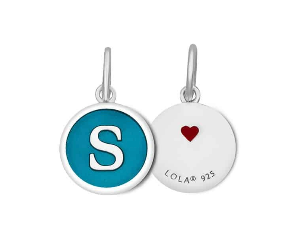 Front & Back of A Lola sterling silver pendant with an enamel inlay in the shape of the letter 'S', with a blue and white color scheme. Available at Be Charmed