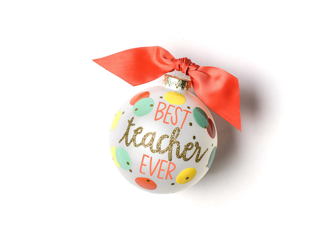 Front view of Coton Colors “Best Teacher Ever” hand‑painted glass ornament with apple motif, cheerful script and glitter trim—perfect teacher gift – Available at Be Charmed