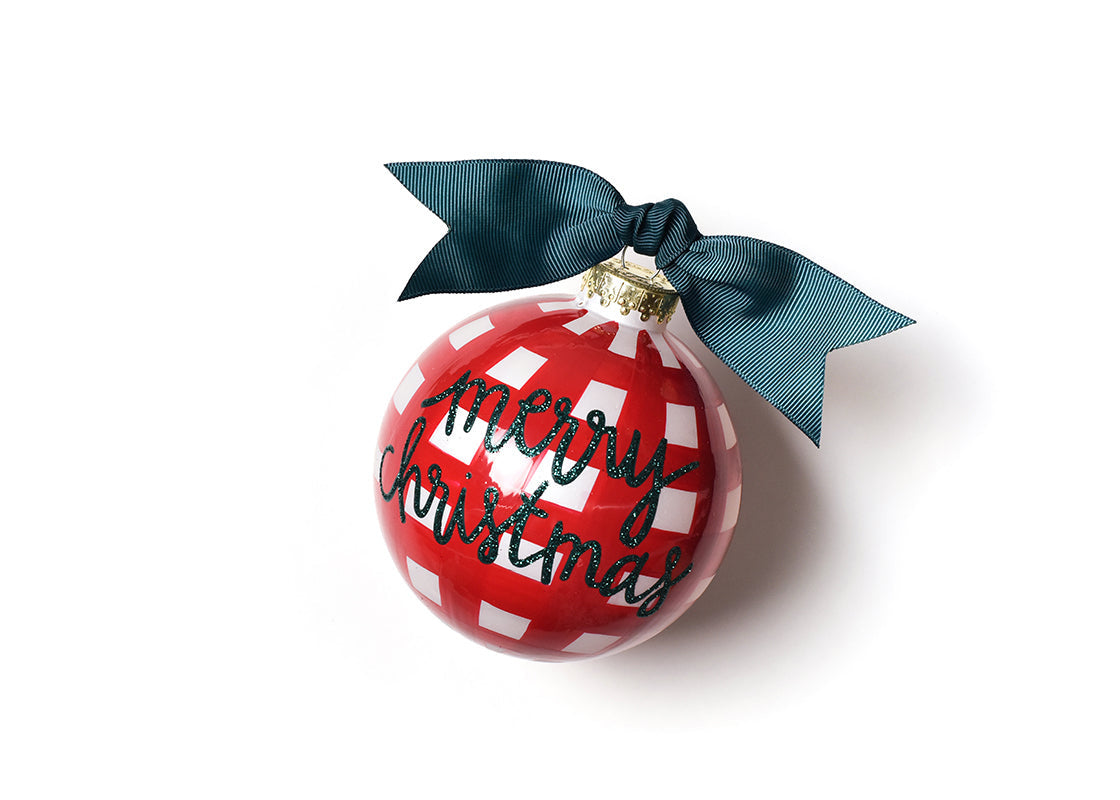 Front view of Coton Colors “Merry Christmas” glass ornament decorated with red and white gingham pattern, festive script, and gold glitter trim—Available at Be Charmed