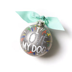 Front view of Coton Colors “I Love My Dog” oversized silver popper glass ornament with hand‑painted paw prints and silver glitter accent, includes swirled metal stand – Available at Be Charmed