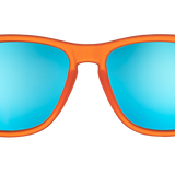 Orange sunglasses with blue reflective lenses on a white background. Available at Be Charmed