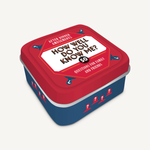 Compact tin labeled “How Well Do You Know Me?” with question‑card prompts—Available at Be Charmed