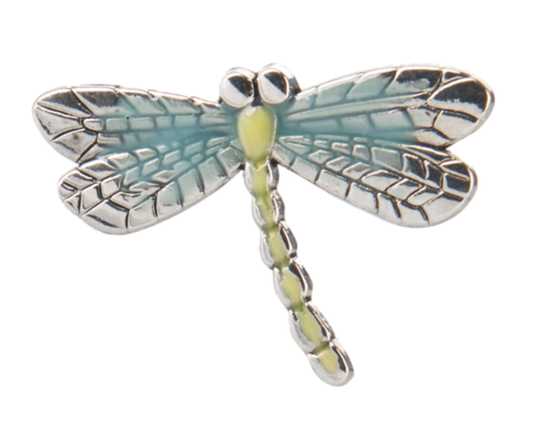 Dragonfly-shaped charm with silver and green details on a white background. Available at Be Charmed. 