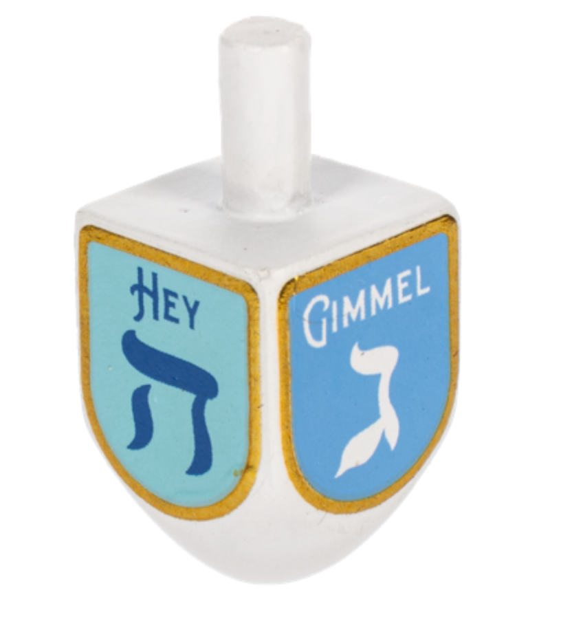 A small Ganz dreidel charm token next to its colorful game instruction card. Available at Be Charmed