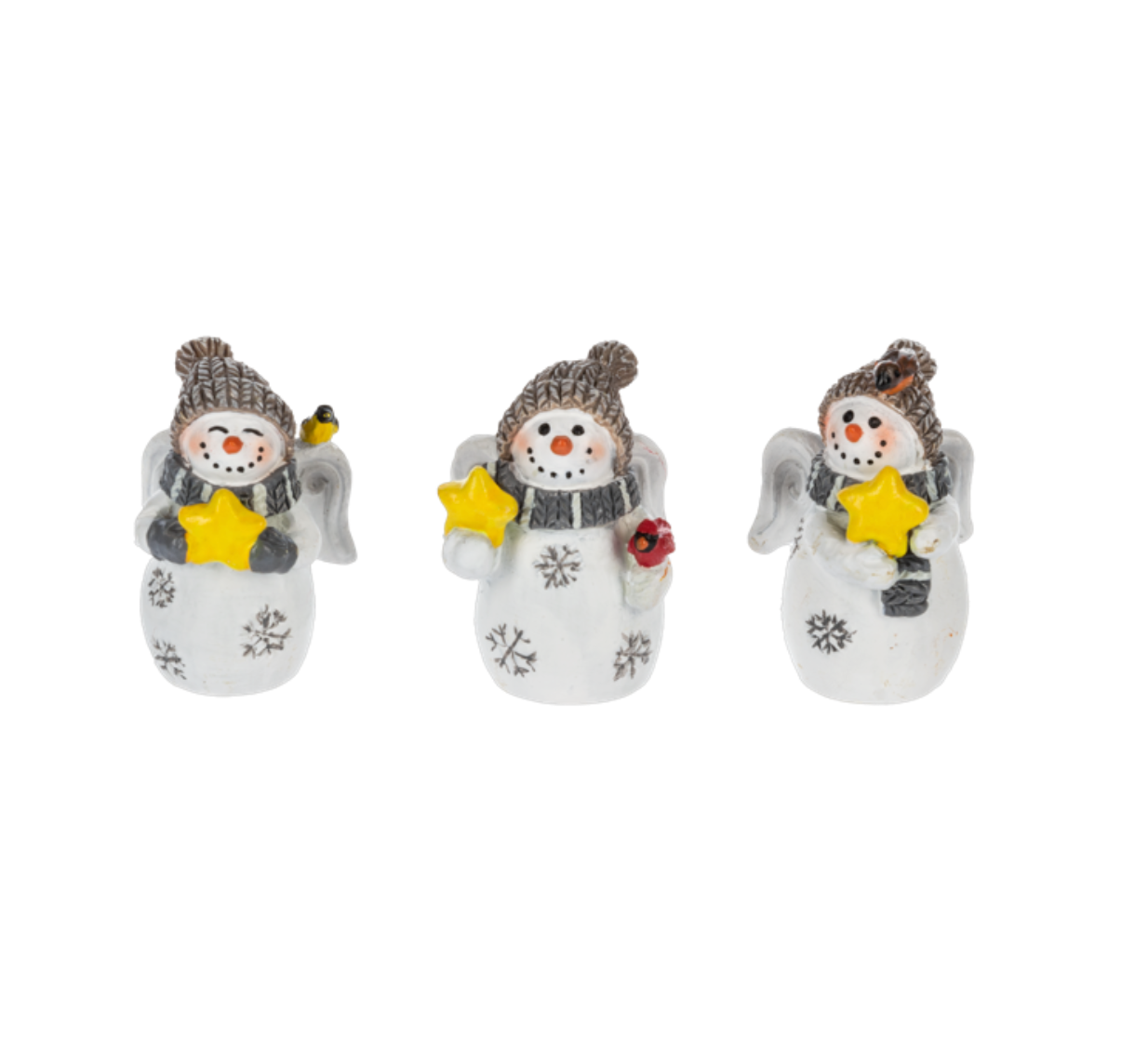 Three white porcelain charms with snow angel designs, each featuring decorative elements such as stars, flowers, and snowflakes. Available at Be Charmed