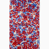 eometry Fire Cracker Tea Towel – White microfiber towel featuring a vibrant pattern of red and blue fireworks, made from recycled materials, available at Be Charmed.