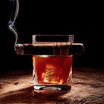 Glass with a cigar orkcicle Cigar Glass – unique double old-fashioned whiskey glass with built-in cigar holder, designed for effortless sipping and smoking in one hand. A refined gift for cigar and whiskey lovers, available at Be Charmed.