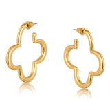 Gold Big Metal London Carmen earrings: 3.5 cm clover‑shaped floral metal hoops in radiant gold or sleek silver plating, hypoallergenic surgical steel posts, made with 50% recycled brass. Lightweight, sustainable fashion at its finest. Available at Be Charmed