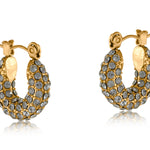 Gold Big Metal London Doris stone‑encrusted stainless steel stud earrings with shimmering crystal inlays, hypoallergenic surgical steel, ideal for sensitive ears. Available at Be Charmed