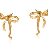 Gold Big Metal London Matte Paloma Bow stud earrings in matte gold or silver finish, recycled brass and surgical‑steel posts, hypoallergenic – Available at Be Charmed
