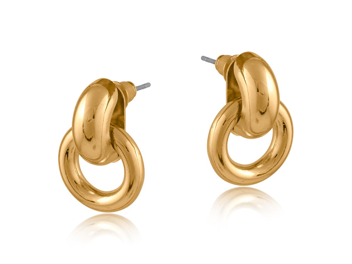 Gold Big Metal London Salema round stud earrings in polished gold or silver-plated recycled metal, hypoallergenic surgical steel posts, 2–3 cm diameter. Sleek, sustainable, everyday chic. Available at Be Charmed