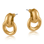 Gold Big Metal London Salema round stud earrings in polished gold or silver-plated recycled metal, hypoallergenic surgical steel posts, 2–3 cm diameter. Sleek, sustainable, everyday chic. Available at Be Charmed