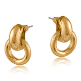 Gold Big Metal London Salema round stud earrings in polished gold or silver-plated recycled metal, hypoallergenic surgical steel posts, 2–3 cm diameter. Sleek, sustainable, everyday chic. Available at Be Charmed