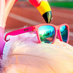 Close up of Goodr Flamingos on a Booze Cruise sunglasses with bright pink frames, polarized lenses, and no-slip grip—fun, functional eyewear at Be Charmed.