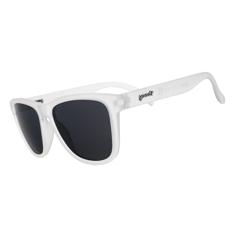 A pair of clear frame sunglasses with black non-reflective lenses, branded with 'goodr' on one side. Available at Be Charmed