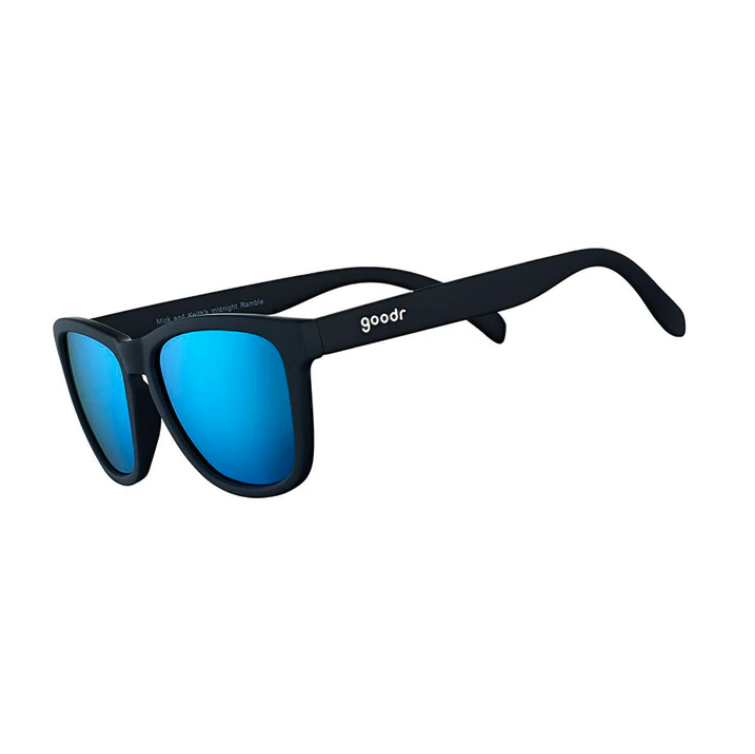 Goodr Mick & Keith's Midnight Ramble Sunglasses featuring classic black frames and blue smoke-tinted polarized lenses, designed for high-energy adventures and effortless cool, available at Be Charmed