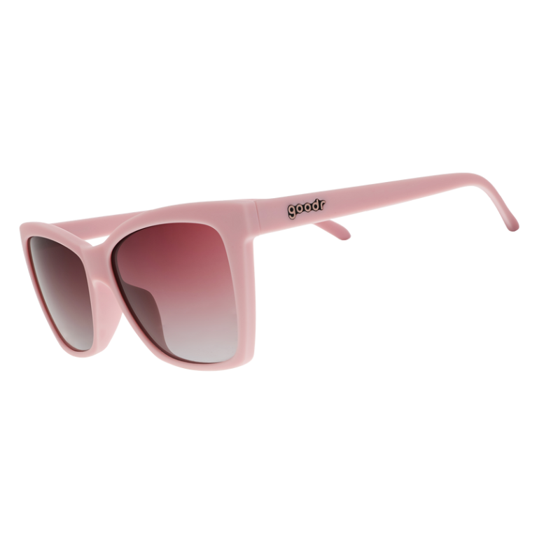 Goodr Rose Retail Therapy Sunglasses with soft rose-pink frames and polarized lenses, combining chic style and sporty comfort, perfect for shopping days, available at Be Charmed