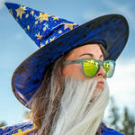 Wizard Wearing Goodr Sunbathing with Wizards Sunglasses featuring vibrant blue frames and green polarized lenses, combining mystical style with sport-ready performance, available at Be Charmed