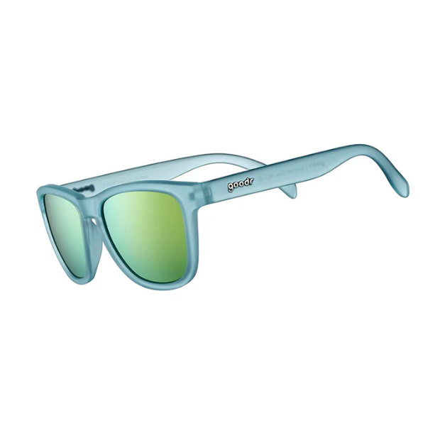 Goodr Sunbathing with Wizards Sunglasses featuring blue frames and green polarized lenses, combining mystical style with sport-ready performance, available at Be Charmed