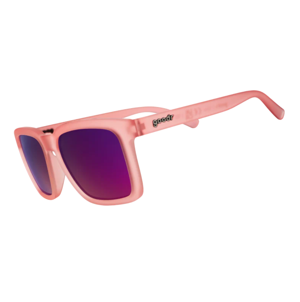 Goodr Pink sunglasses with purple lenses on a white background. Available at Be Charmed