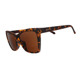 A pair of Goodr Vanguard Visionary sunglasses with a tortoiseshell pattern and brown lenses. Available at Be Charmed
