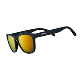 A pair of Goodr sunglasses with black frames and amber lenses. Available at Be Charmed