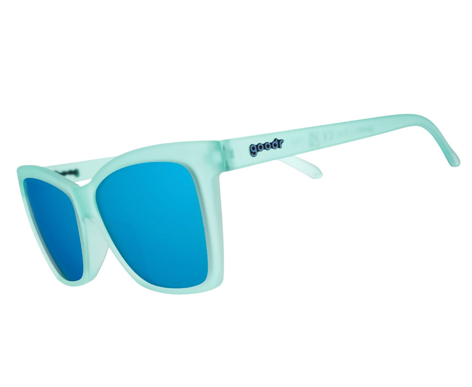 Goodr Will Brake For Mermaids Sunglasses with ttranslucent teal frames and reflective tealpolarized lenses, combining playful ocean vibes and performance fit, available at Be Charmed