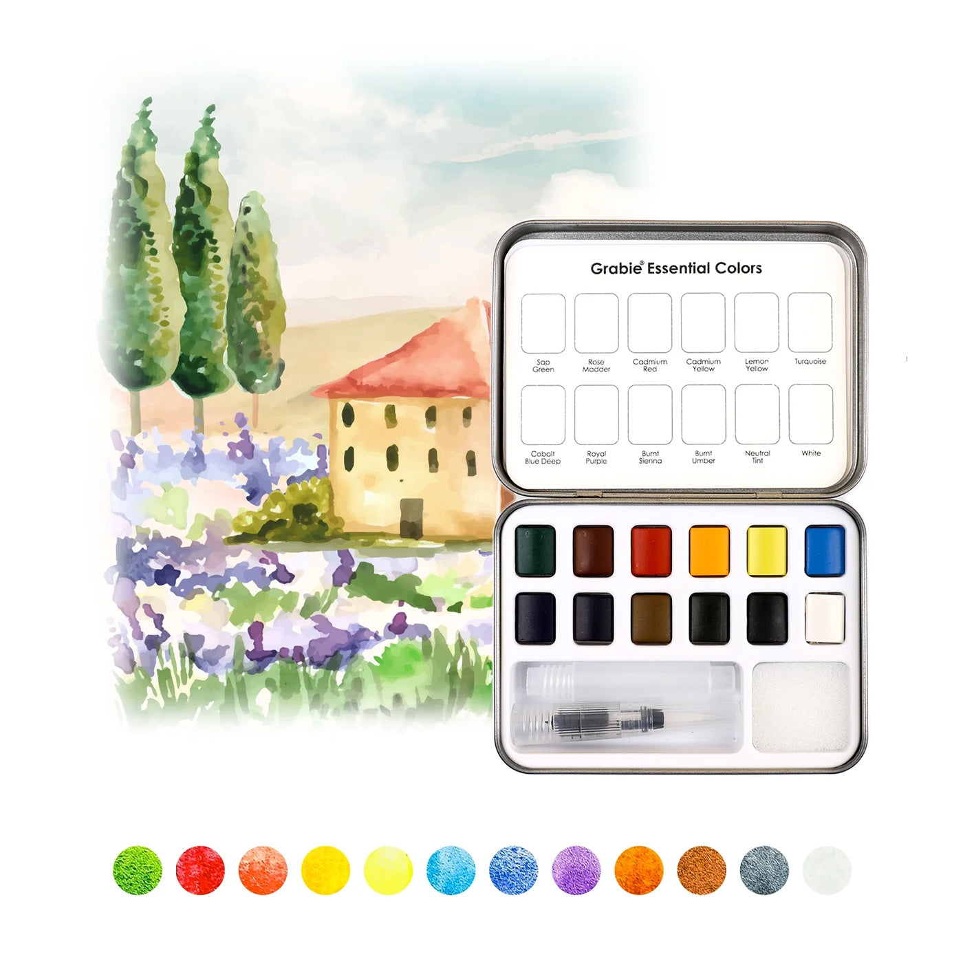 Watercolor paint set with a scenic painting on the lid and color swatches below. Available at Be Charmed
