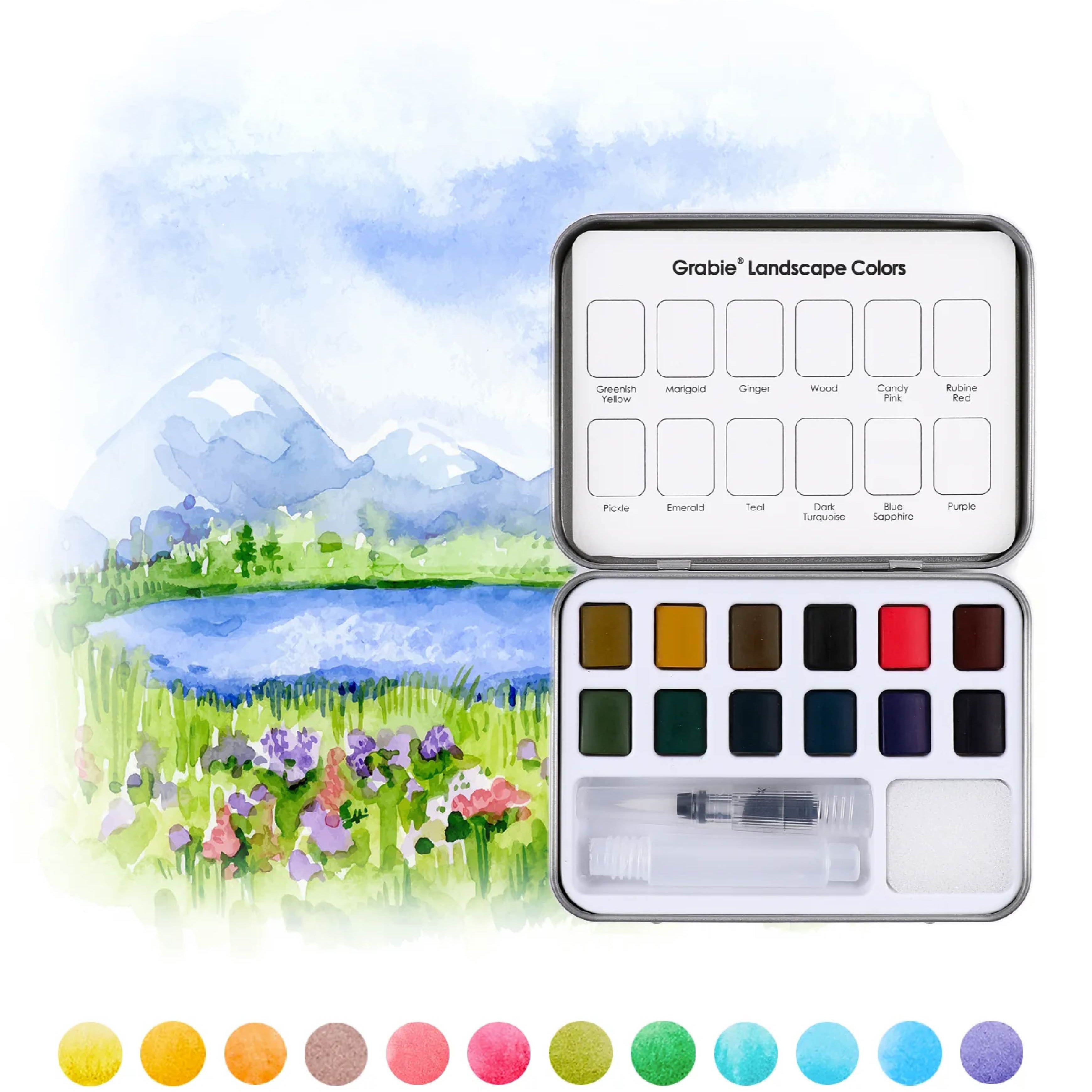 Grabie Watercolor paint set with a landscape illustration on a white background. Available at Be Charmed