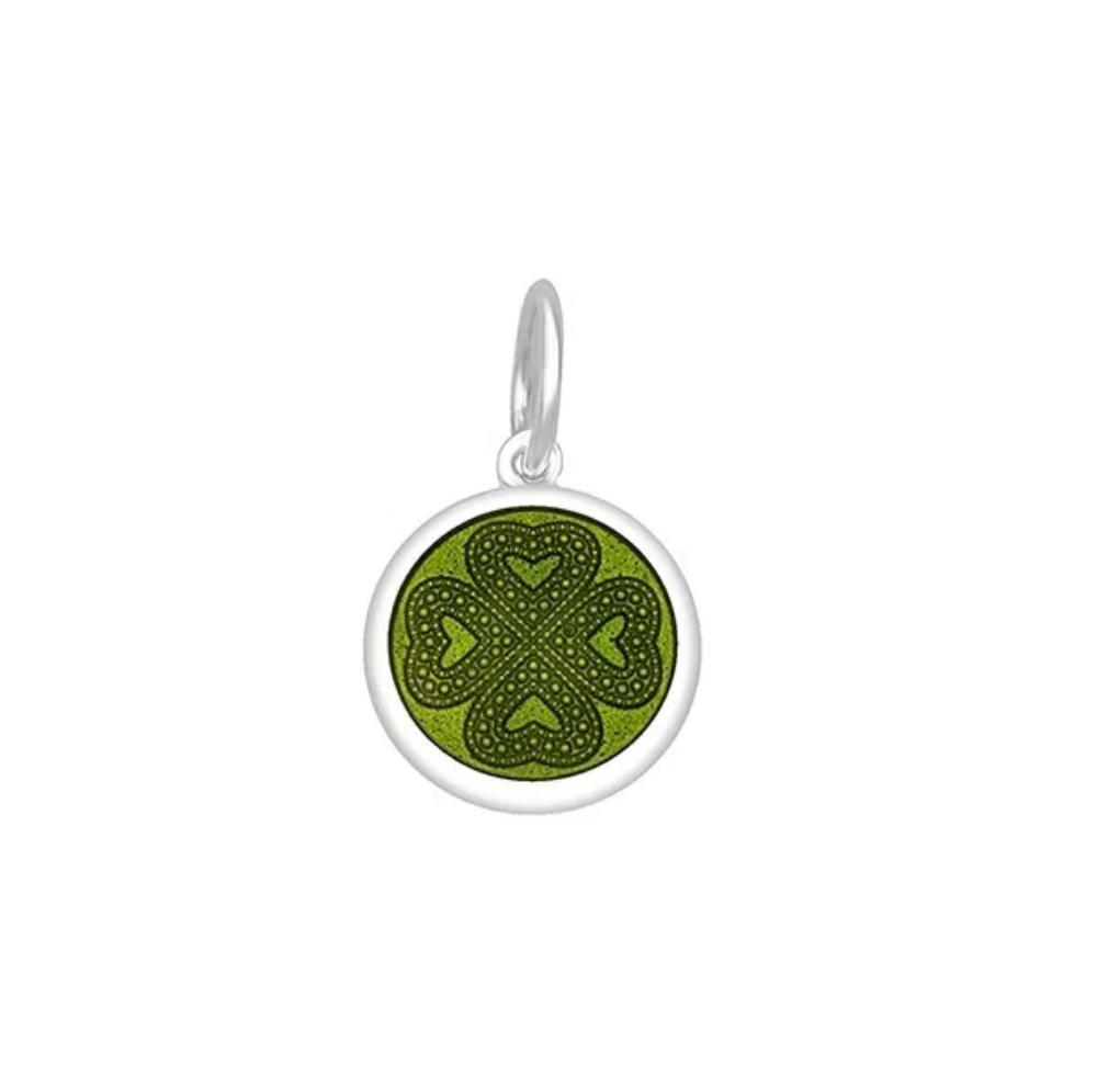 A round Lola green pendant with a four leaf clover design. Available at Be Charmed