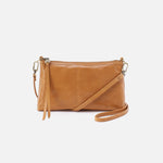 Natural leather Hobo crossbody bag on a white background. Available at Be Charmed