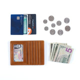 Brown HOBO wallet with cards, money, and coins on a white background. Available at Be Charmed