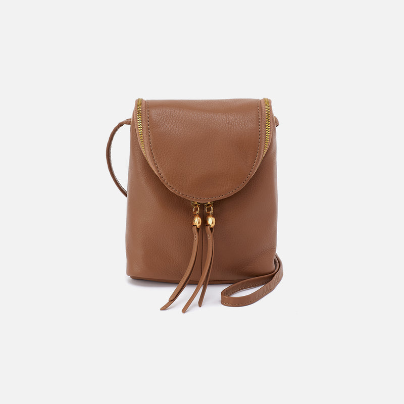 Timber Brown HOBO leather crossbody bag with gold accents on a white background. Available at Be Charmed