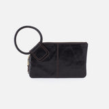 Black HOBO clutch bag with a ring handle on a white background. Availablea at Be Charmed