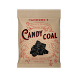 Black candy coal pieces shaped like lumps of coal, perfect for holiday treats and stocking stuffers. Available at Be Charmed.