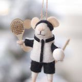 Felt mouse ornament with a tennis racket and ball on a blurred snowy background. Available at Be Charmed