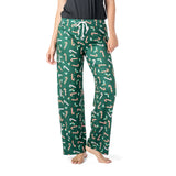 Green pajama pants with candy cane pattern worn by a person on a white background. Available at Be Charmed
