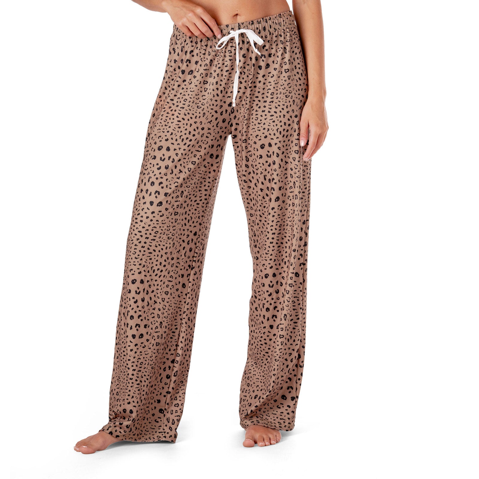 Leopard print pajama pants with a white drawstring on a white background. Available at Be Charmed