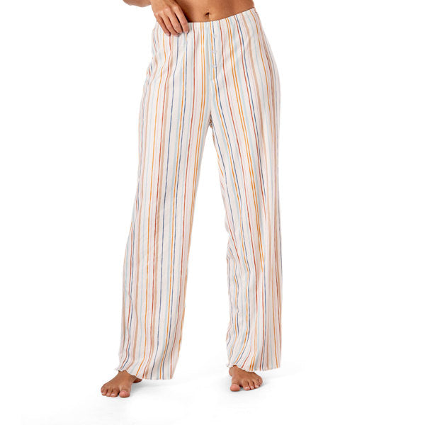 Striped pajama pants worn by a person on a white background. Available at Be Charmed