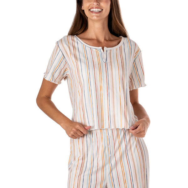 Woman wearing a striped pajama set on a white background. Available atBe Charmed