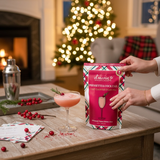 Holiday picture with D’marie Craft Cocktail Slush Mix – Poinsettia flavor, perfect for festive cocktails, parties, or gifting, available at Be Charmed.