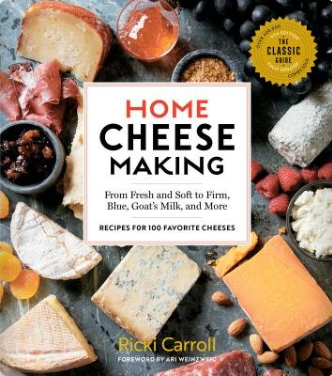 Book cover of 'Home Cheese Making' with cheese and ingredients on a dark surface. Available at Be Charmed