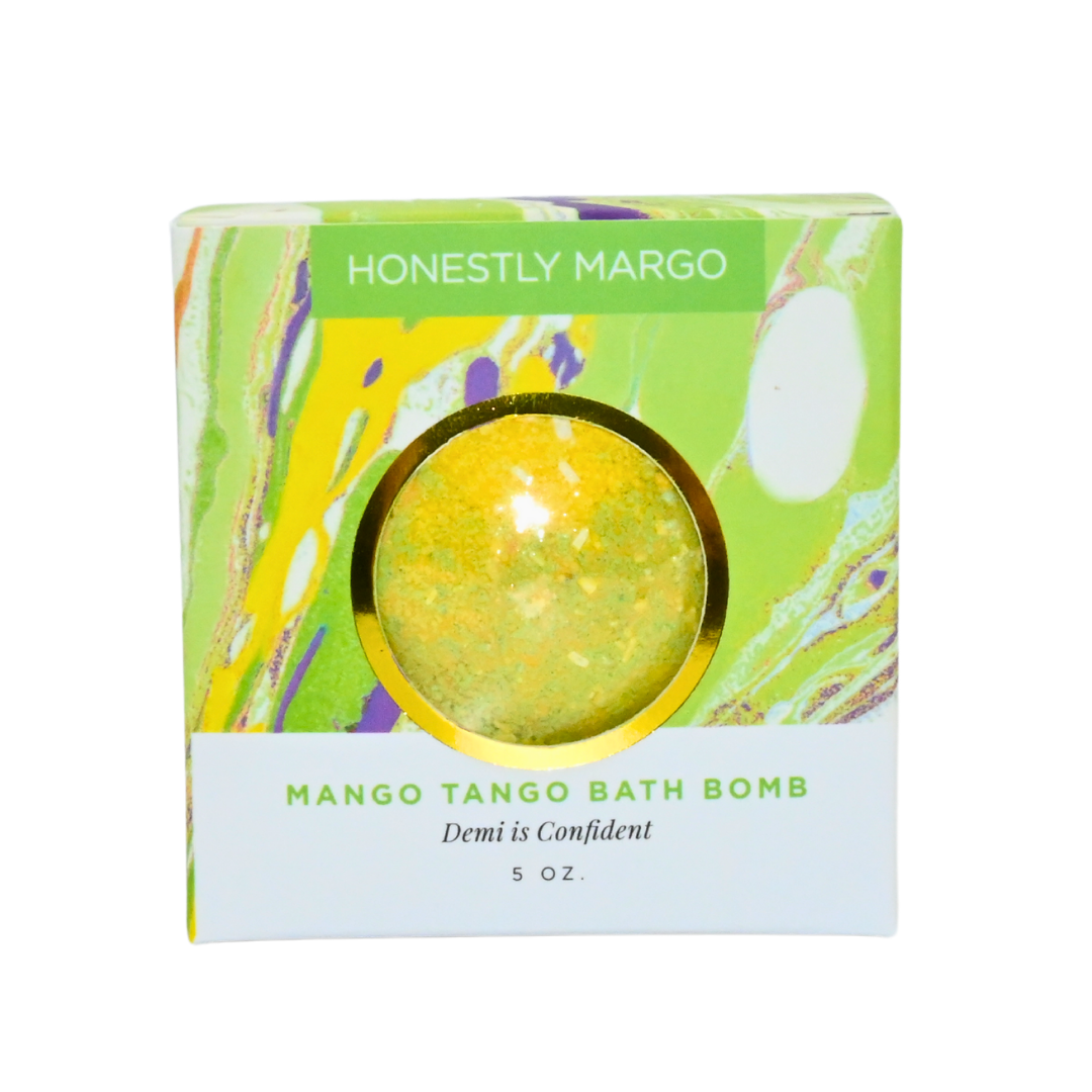 Mango Tango bath bomb packaging with 'Honestly Margo' branding on a white background. Available at Be Charmed